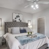 a bedroom with a bed and a nightstand
