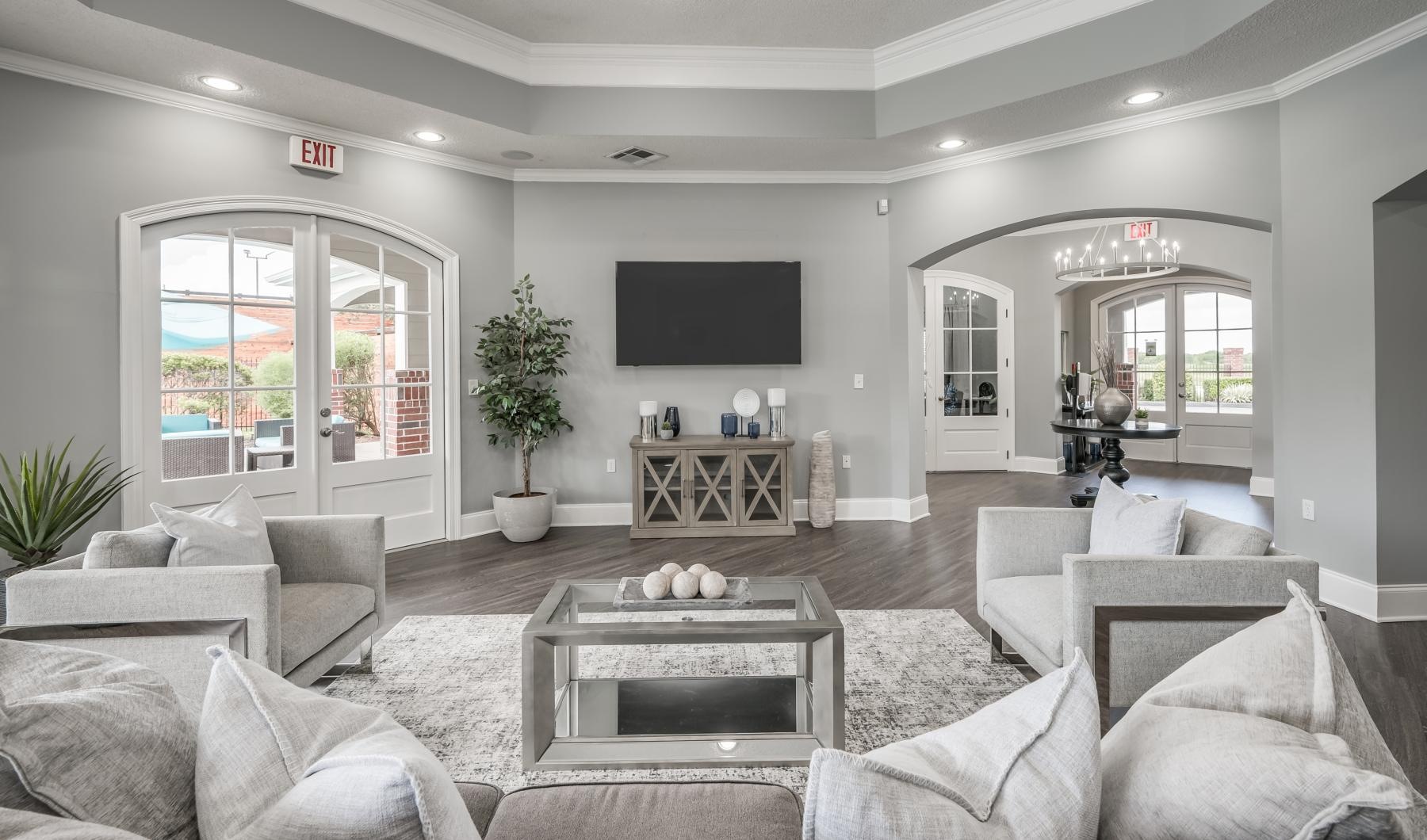 Find your perfect fit at The Flats at Sugarland a living room with a large tv