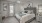 a bedroom with a bed and a fan