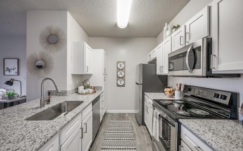 a kitchen with white cabinets